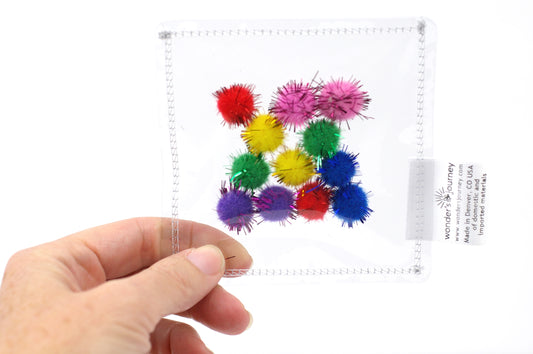Clear sensory pouch with pom poms - Wonder's Journey