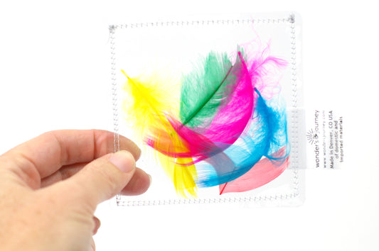 Clear sensory pouch with feathers - Wonder's Journey