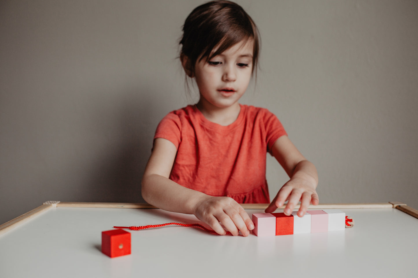 Valentine's Day toddler lacing beads - Wonder's Journey