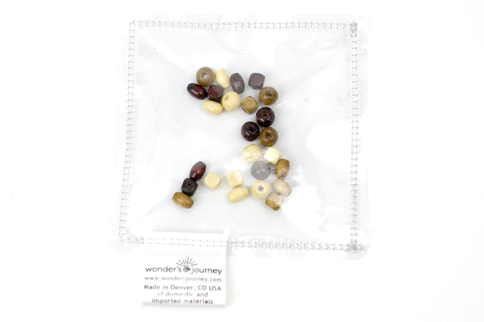 Clear sensory pouch with wooden beads - Wonder's Journey