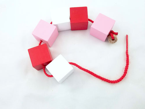 Valentine's Day toddler lacing beads - Wonder's Journey
