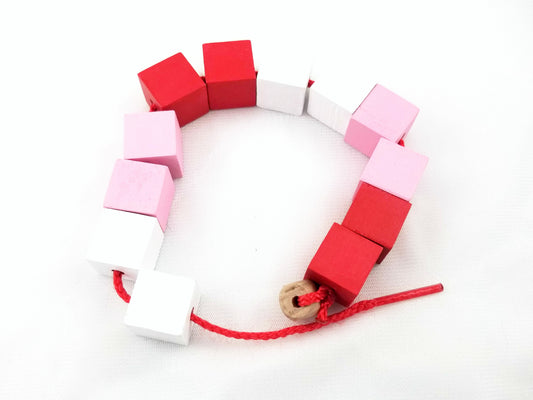 Valentine's Day preschool lacing beads - Wonder's Journey