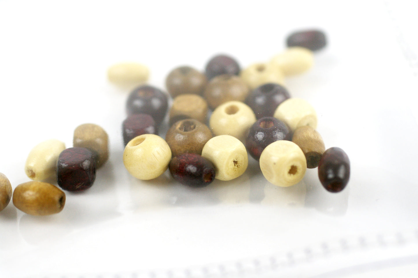 Clear sensory pouch with wooden beads - Wonder's Journey