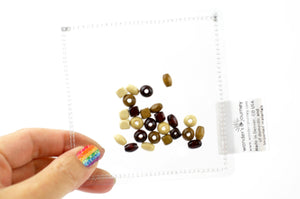 Clear sensory pouch with wooden beads - Wonder's Journey